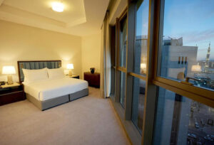 Umrah Package guest room at Worth Peninsula Madinah with city view
